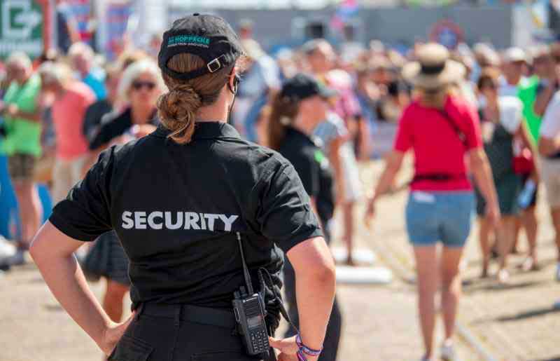 a woman in a security uniform at an event